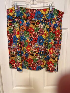 Casual polyester and spandex skirt with attached shorts.